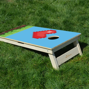 cornhole cœur de vie bonus retro gaming pixelisé, sur le gazon, vue de derrière